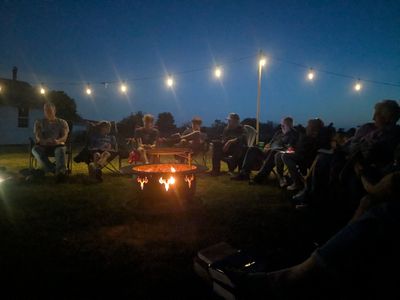 Citylight Dover community group around a fire
